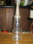 Marquette Mfg., St. Paul, Minn., 1 quart oil bottle, $155. 