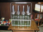 Standard Oil Company Service Oil Bottles, set of 8, (all have the Standard Oil Company Service embossed on glass, 4 bottles have slightly greener tint to the glass), rack included, $1,995. 